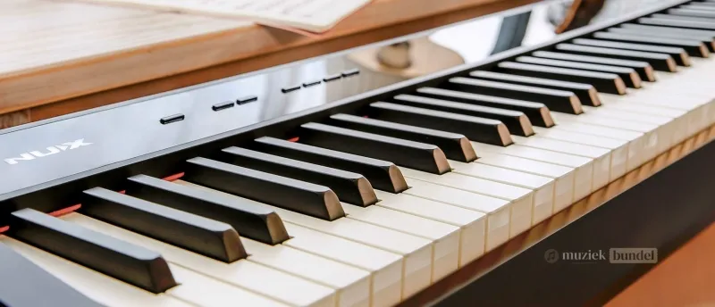Wat maakt de NUX NPK-10 bijzonder? | Muziekbundel.nl Kenmerken van de NUX NPK-10 digitale piano: modern design, uitgebreide functies en hoogwaardige kwaliteit.